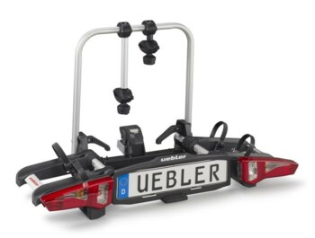 Skládací nosič jízdních kol Uebler i21. Umožňuje složení nosiče do ještě menších rozměrů a zároveň rychlejší a pohodlnější uchycení k tažnému zařízení. Je vyráběn prvotřídní německou firmou UEBLER 